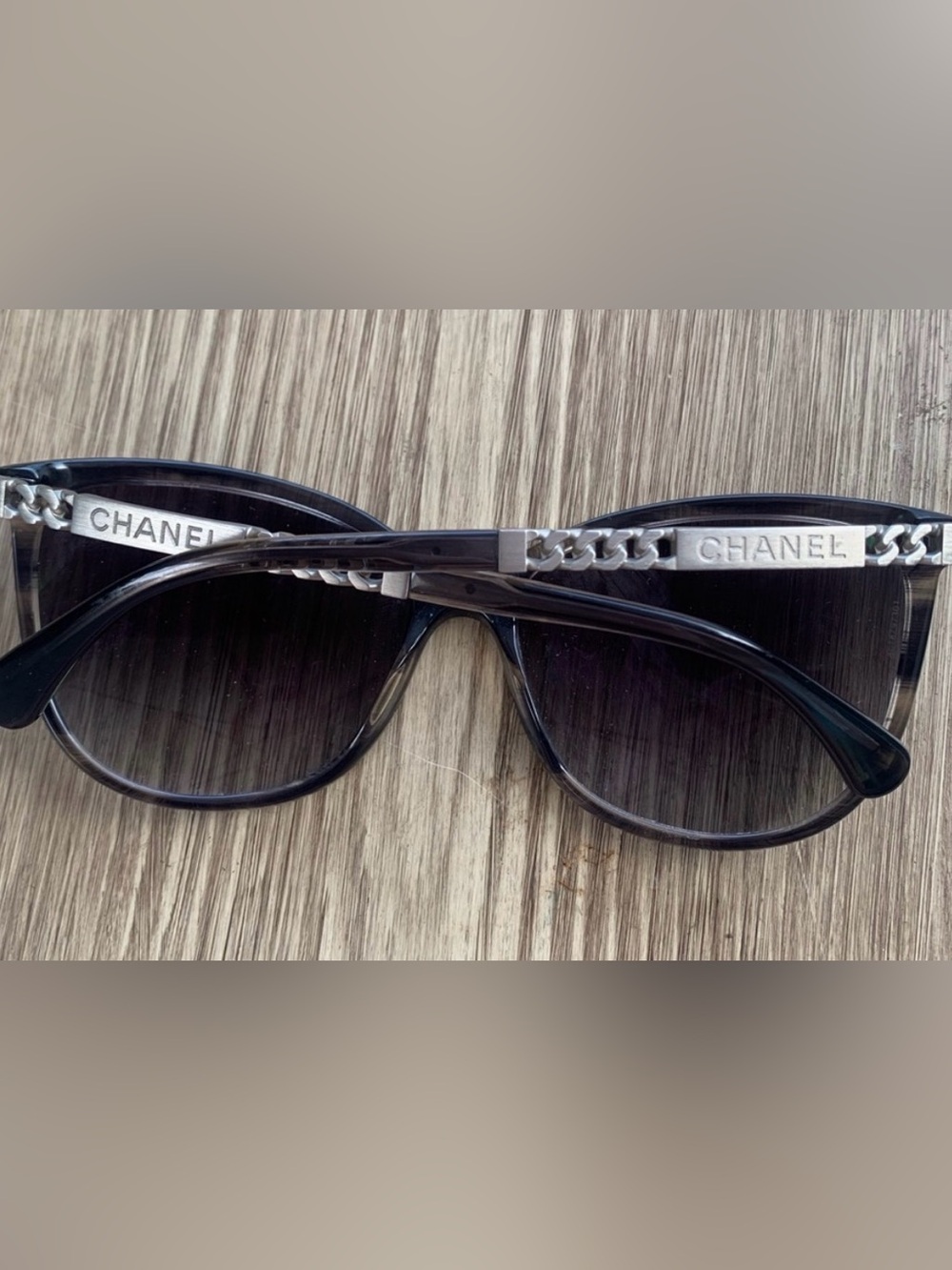 CHANEL Black Cat-Eye Sunglasses with Silver Chain Temples